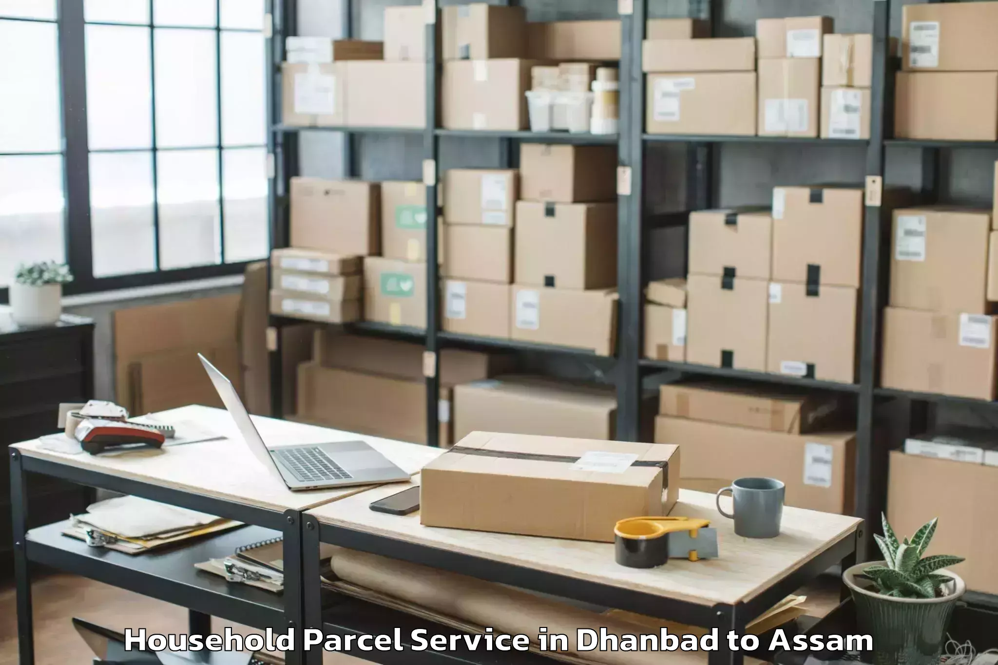 Top Dhanbad to Raha Gaon Household Parcel Available